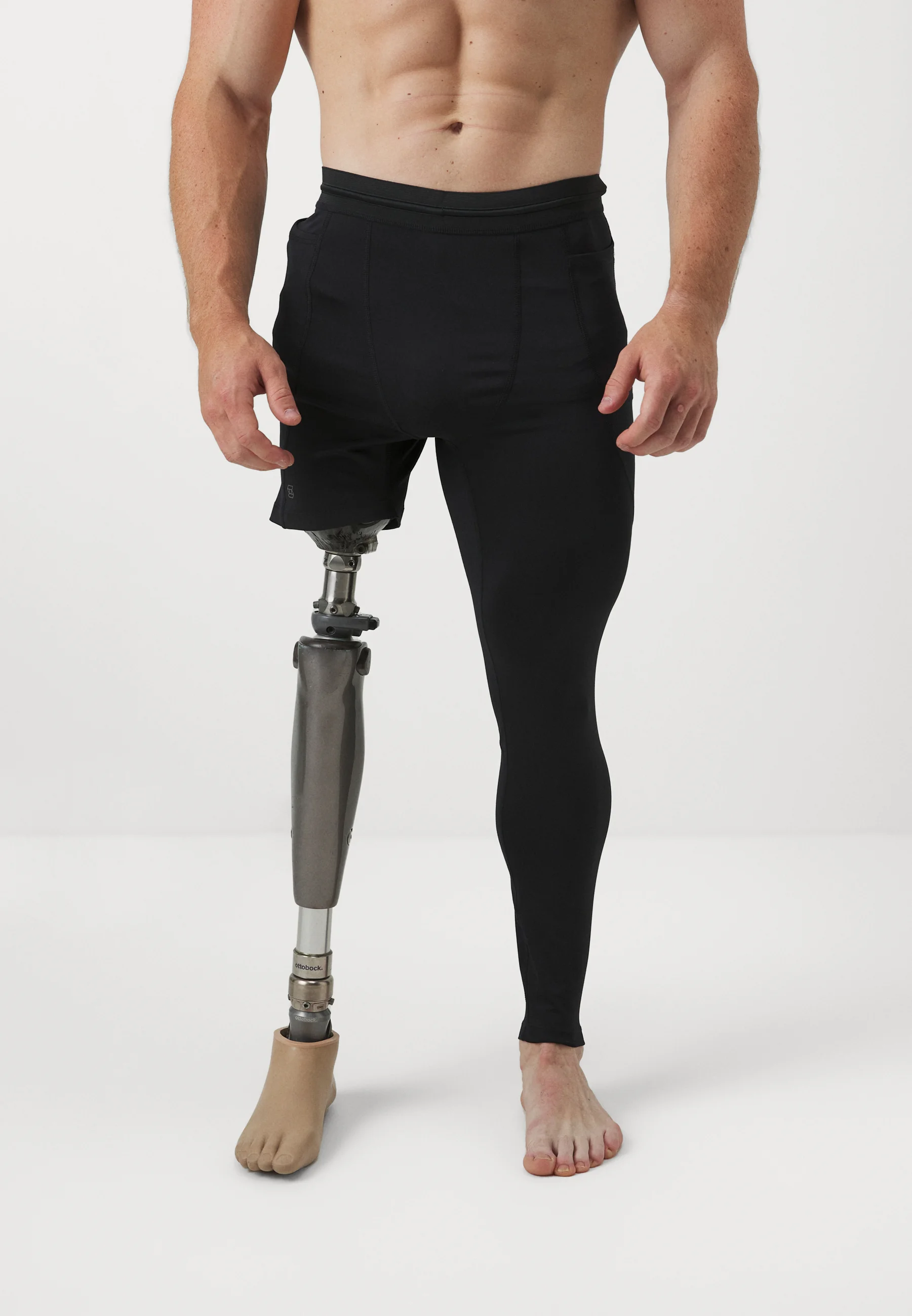 Man wears leggings with right leg at short length and left leg at full ankle length